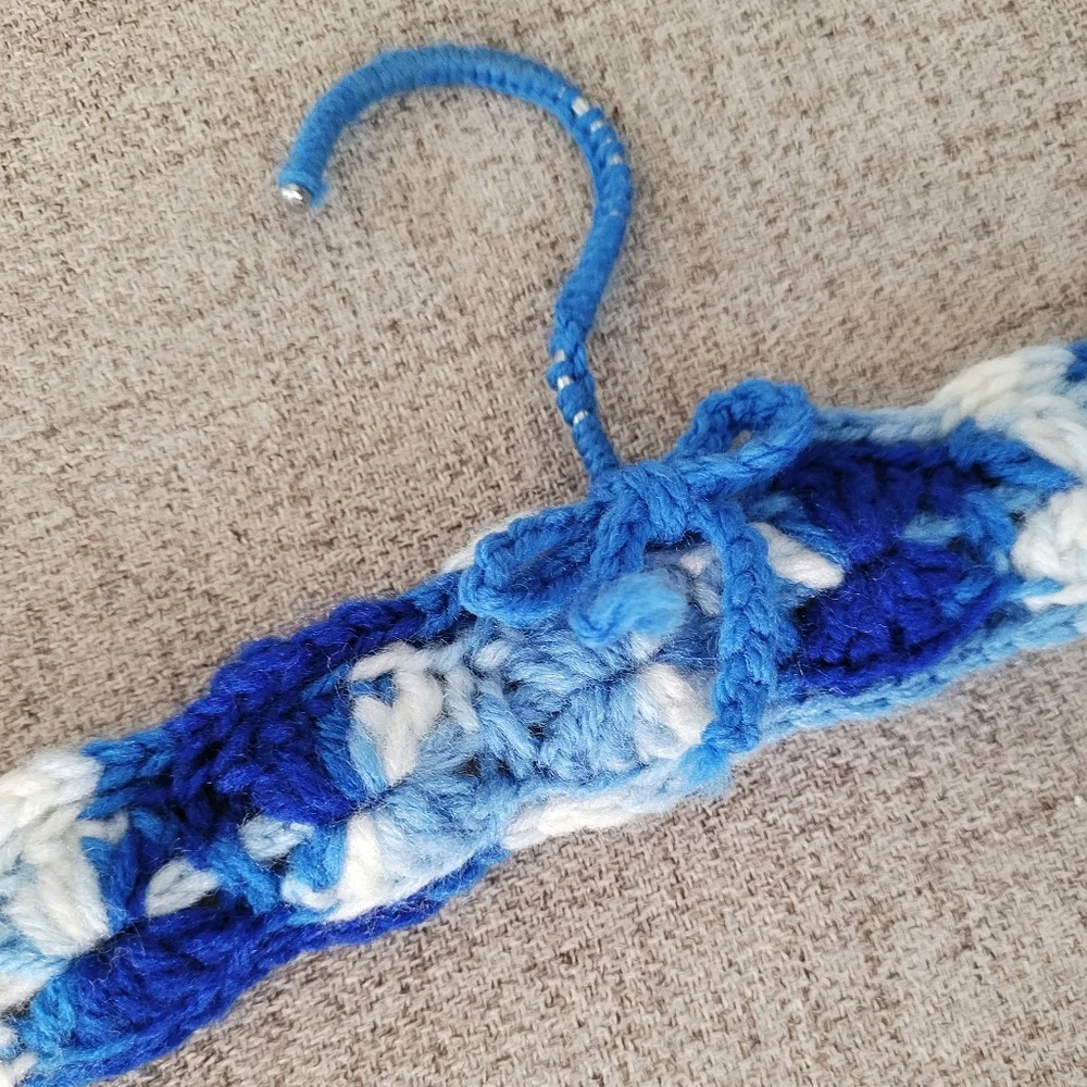 Vintage handmade knit clothing hanger